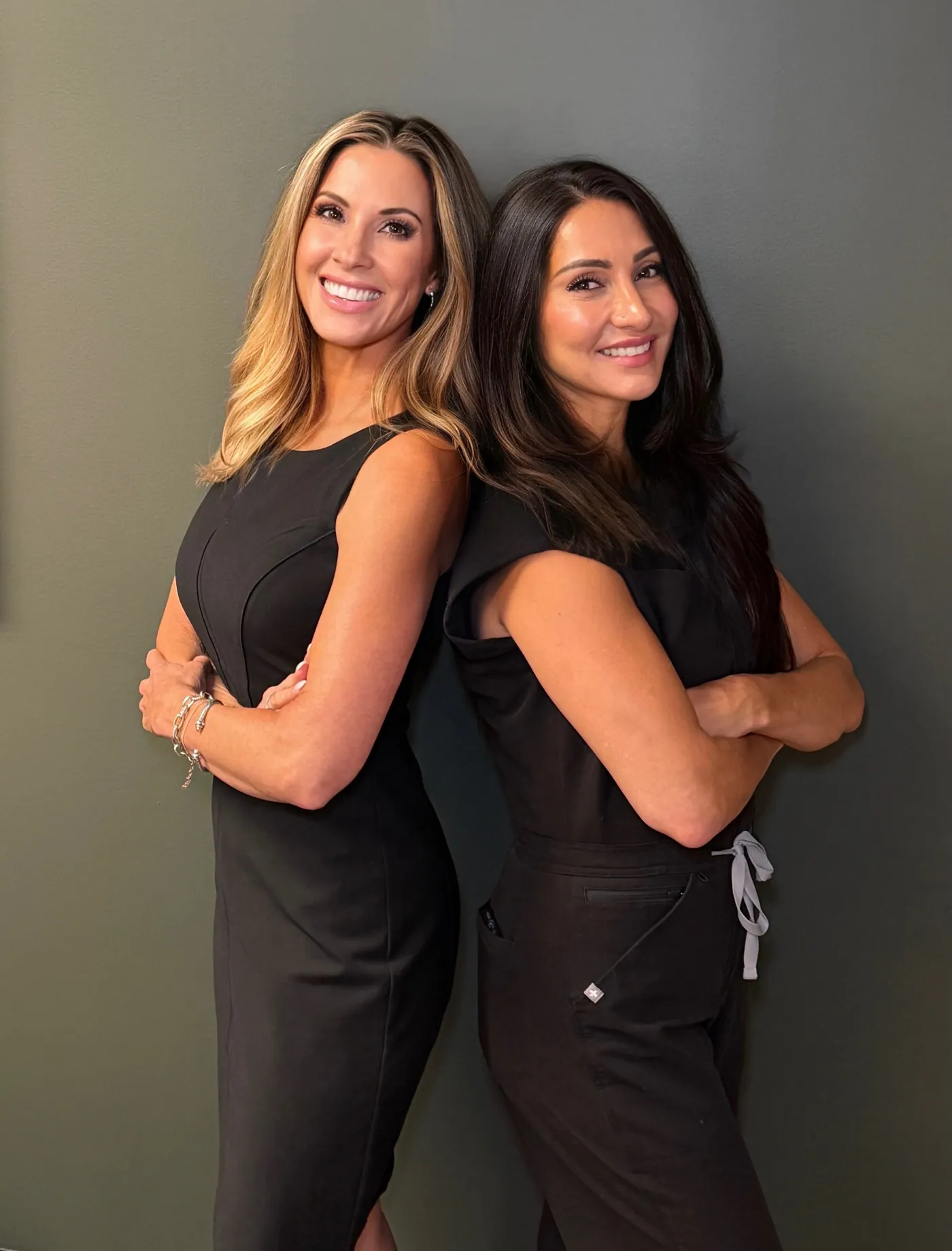 Jen Wells-Koepke, Founder and CEO, and Sara Kranke, DNP, Medical Director, standing back to back